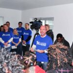 Inside the Sammons house as the home is dedicated and the keys are handed over from the sponsor to the partner family.