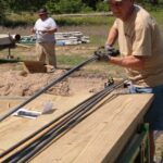 Team member preparing rebar to be cut and sorted