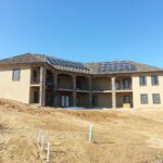 Back of house with solar panels