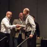Alfonso Nieves (BuildBlock) and Joel Johns (Green Built) accept award