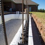 Vertical rebar extends from the footer into the walls.