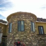 Completed radius wall with stone and windows
